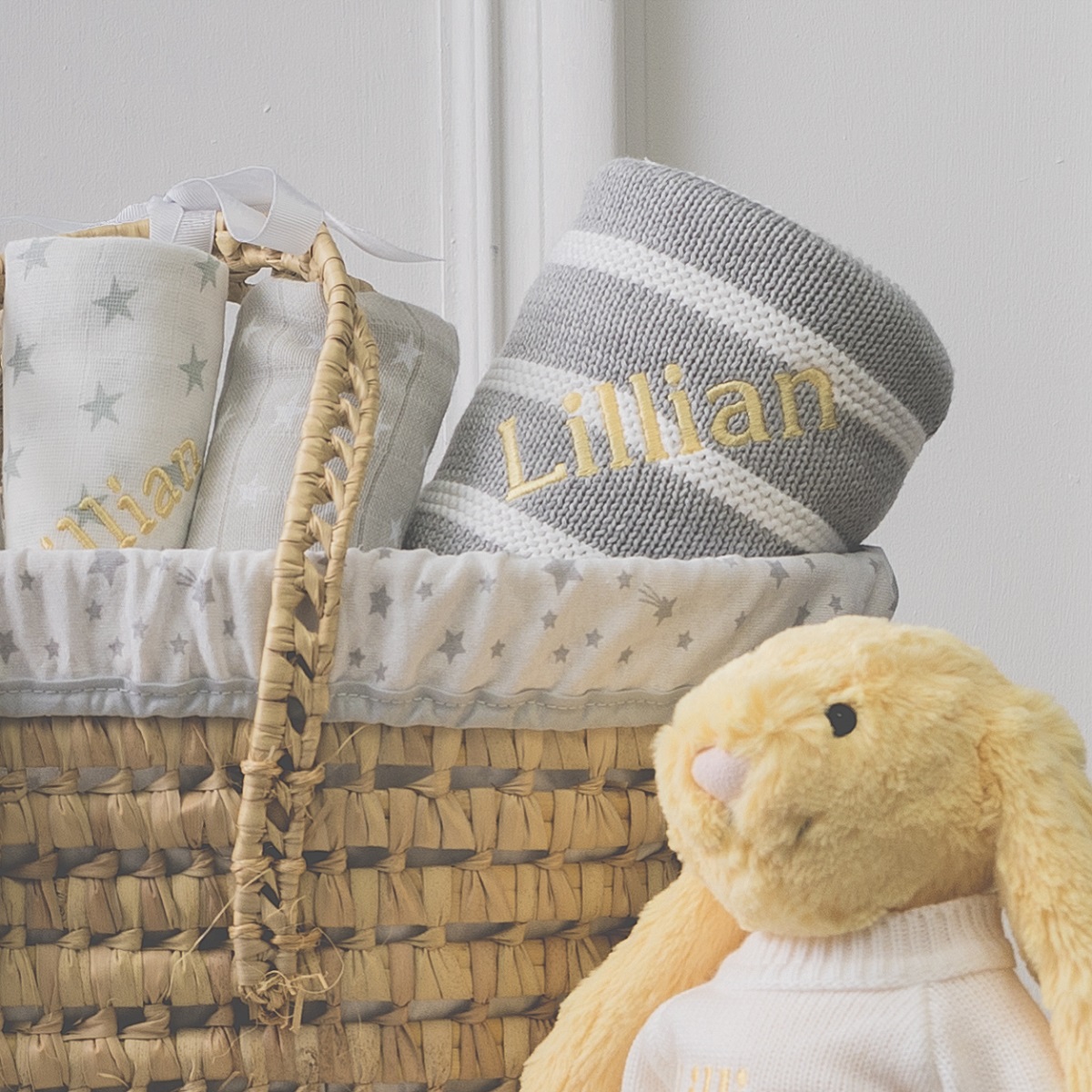 Personalised white and grey baby gift basket with lemon bunny soft toy
