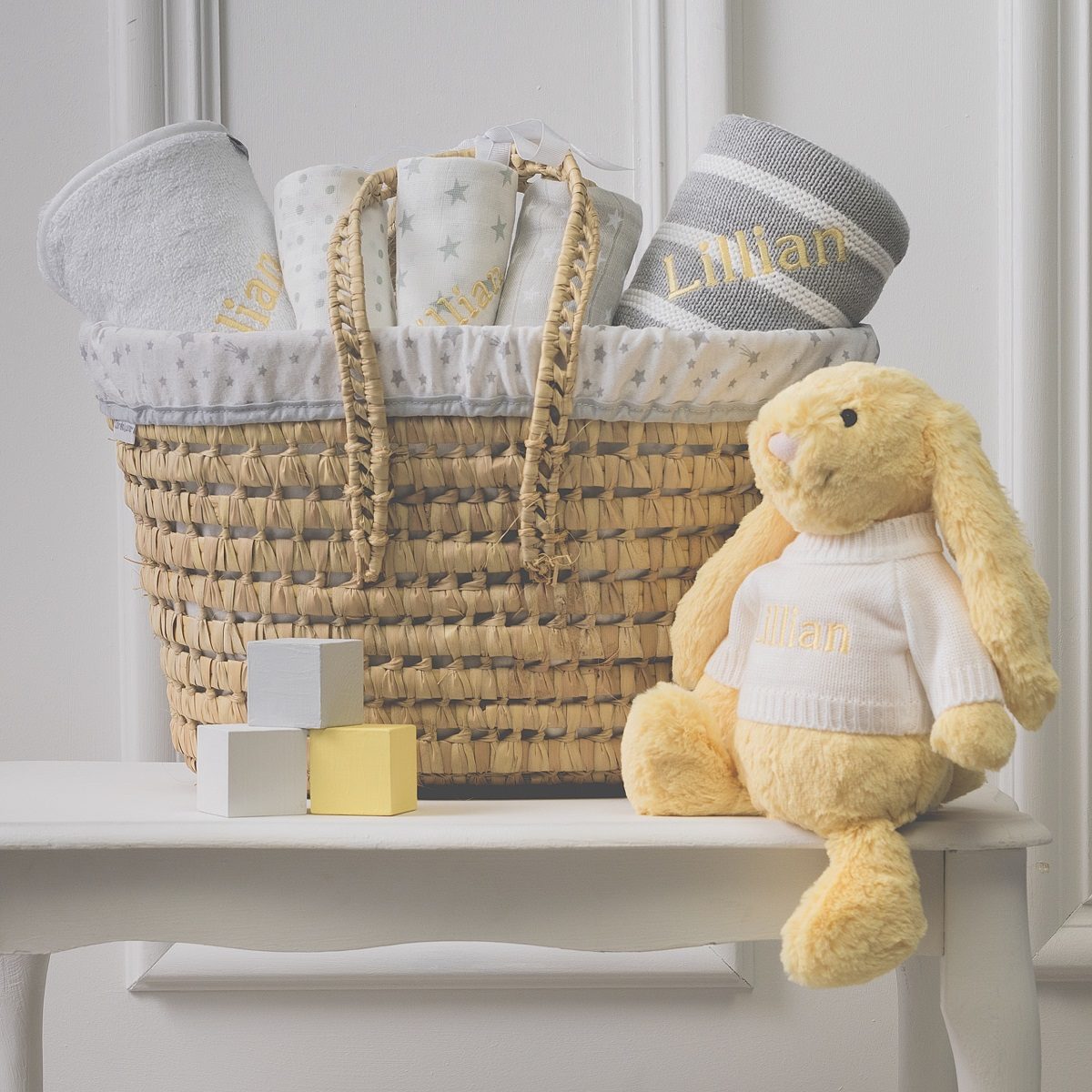 Personalised white and grey baby gift basket with lemon bunny soft toy