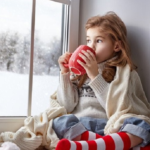 Hygge girl drinking from mug