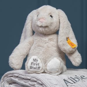 Personalised white and blue baby gift basket with blue bunny soft toy