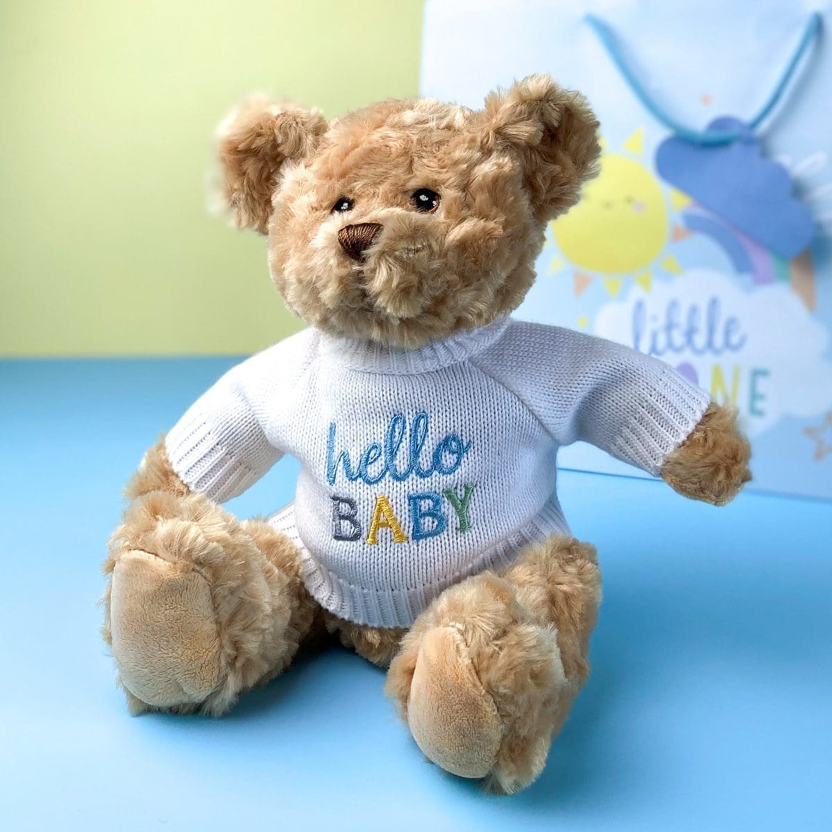Keeleco recycled small Dougie gift bear soft toy with blue 'Hello Baby' jumper
