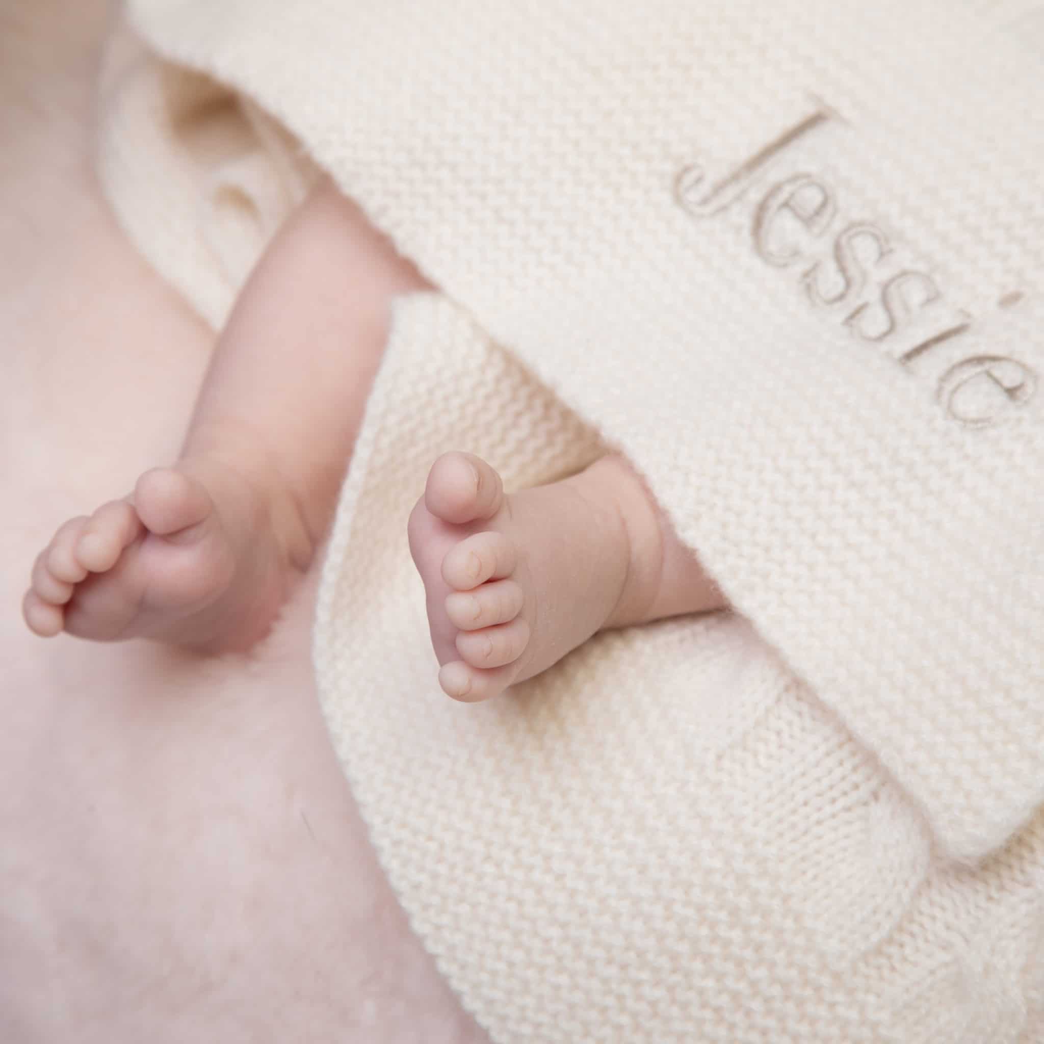 Babys feet wrapped in Personalised blanket