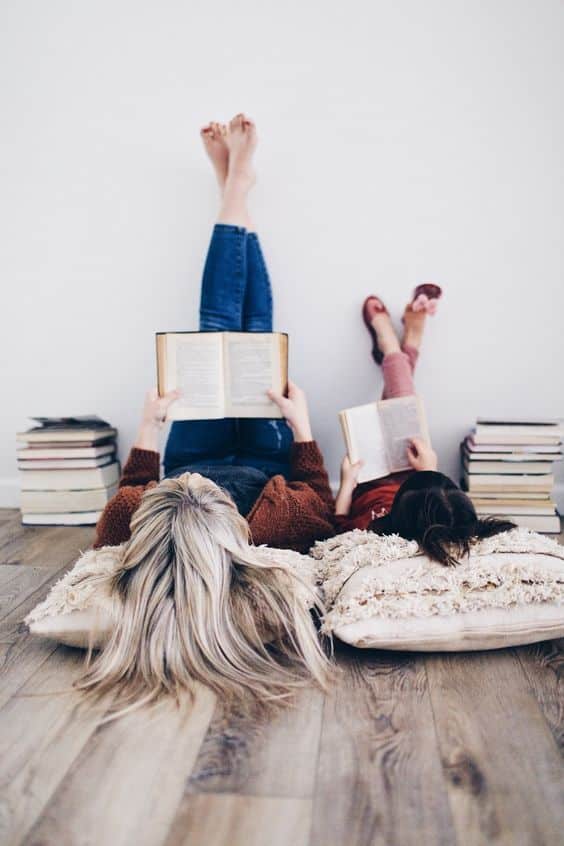 Child Reading Book With Mother