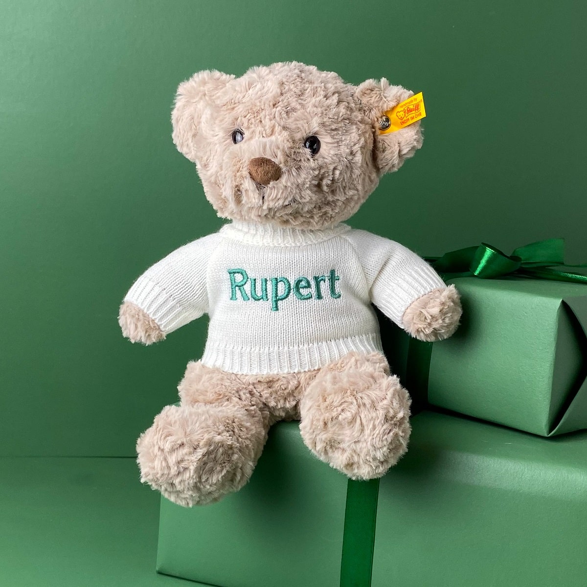 teddy bear with personalised green text sweater